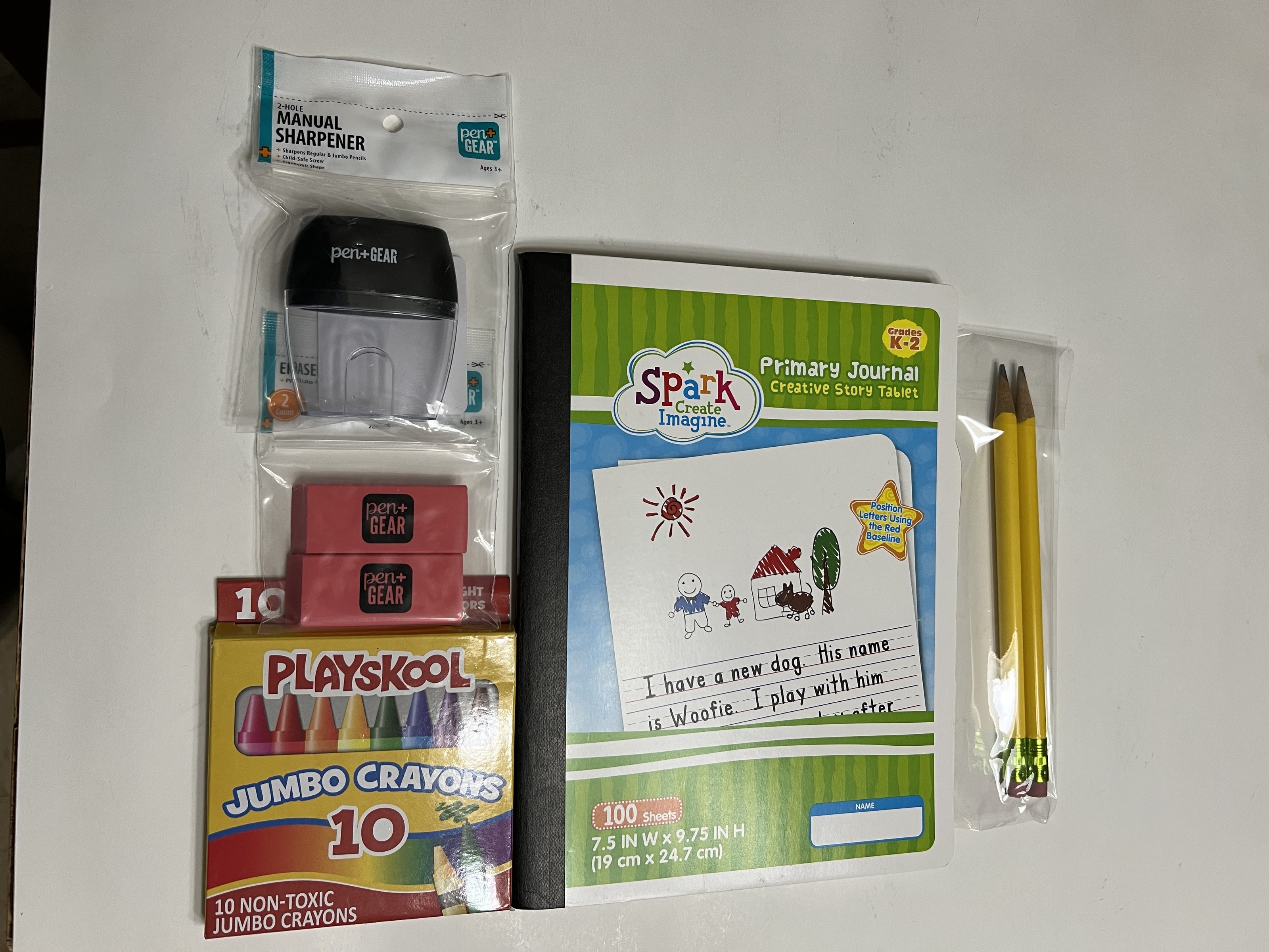 Half Page Ruled Primary Journal, Grades K-2 Writing Journal bundled with school supplies.
